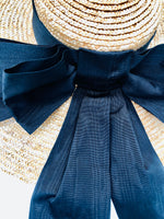 oversized wide brimmed natural straw extra large boater hat with large black moire ribbon bow with long tails