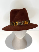 Bronze rust felt trilby fedora for Cheltenham festival with natural feather band