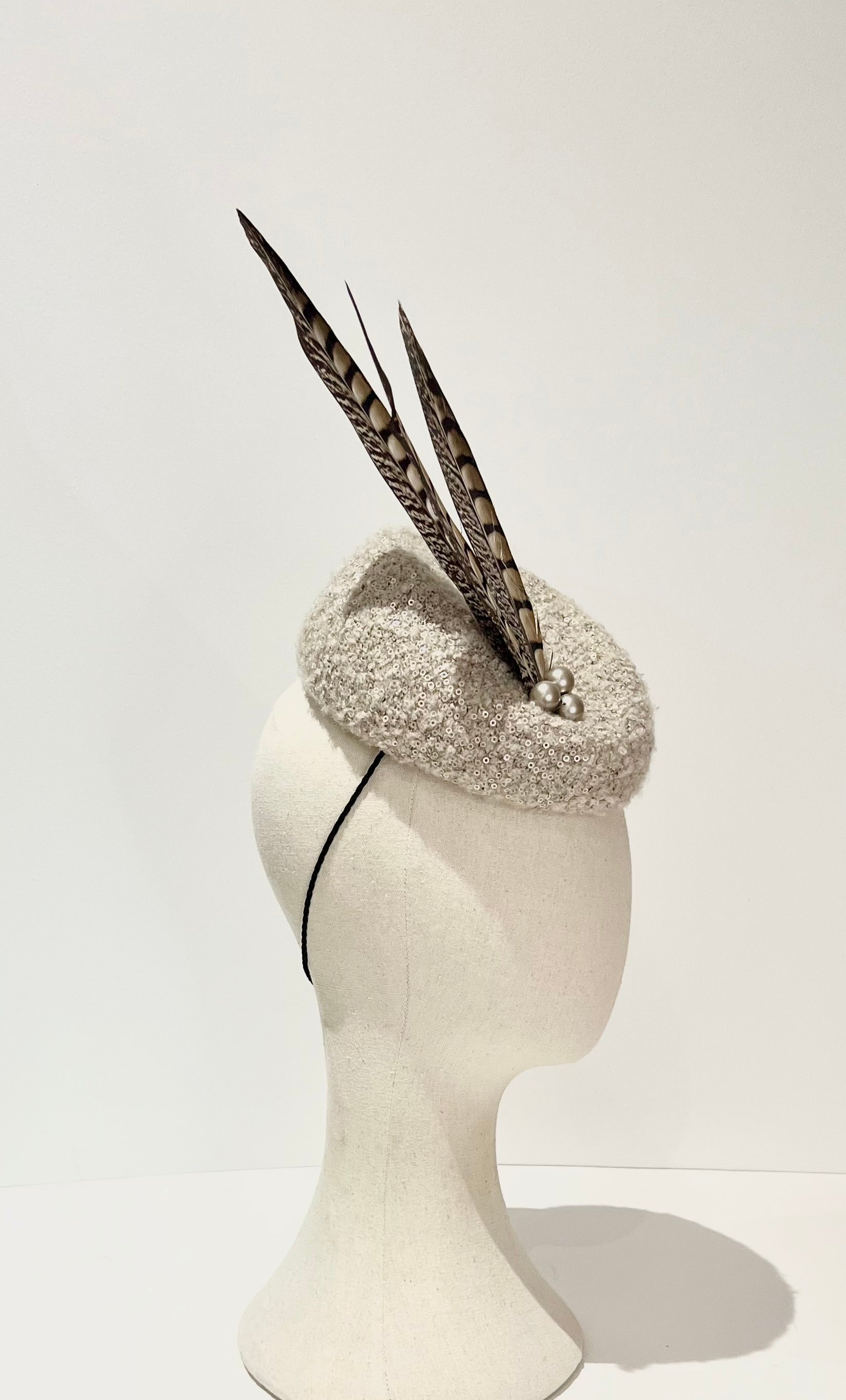Cheltenham gold cup hat fascinator neutral wool fabric with natural feathers 