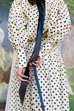 padded headand with black spotty dress ribbon tassels