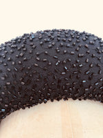 close up detail of black padded wide headband