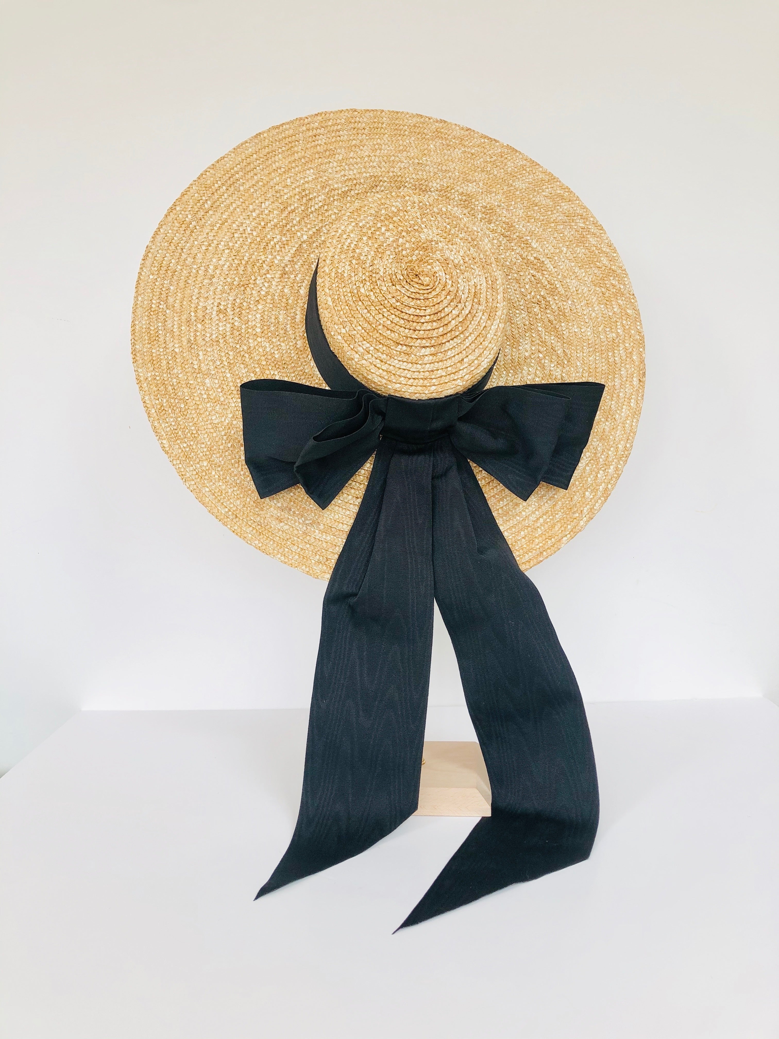 oversized natural straw extra large boater hat with large black moire ribbon bow with long tails