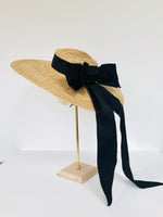 oversized wide brimmed natural straw extra large boater hat with large black moire ribbon bow with long tails