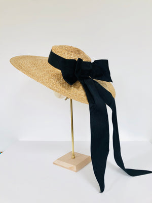 oversized wide brimmed natural straw extra large boater hat with large black moire ribbon bow with long tails