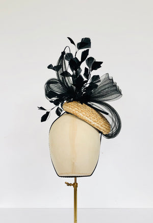 natural straw pillbox fascinator with black feather spray, pleated crin and quill