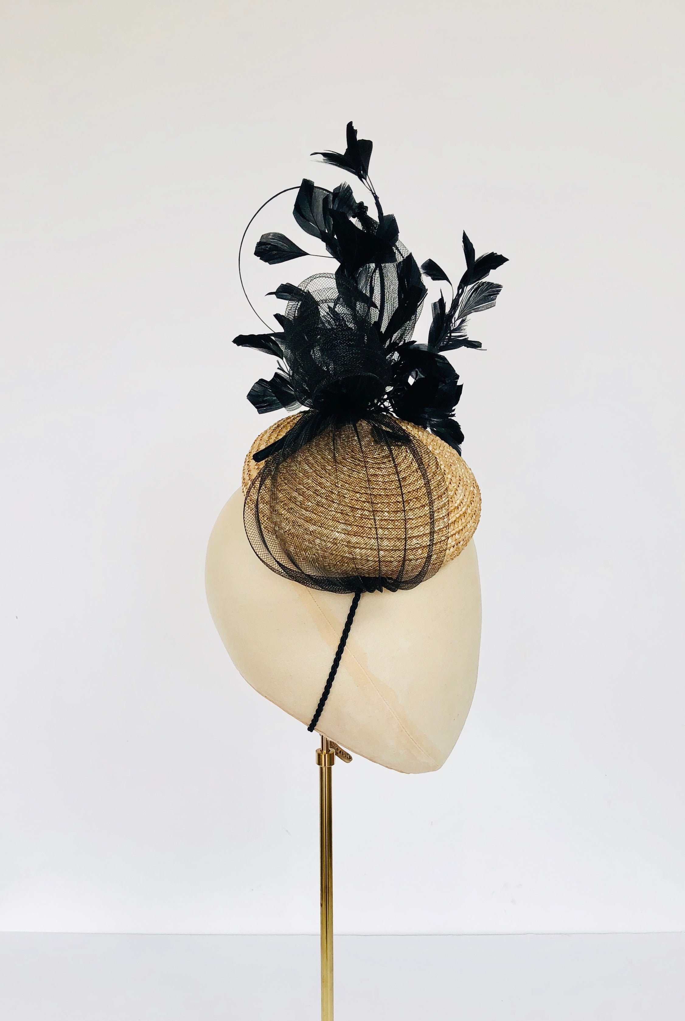natural straw pillbox fascinator with black feather spray, pleated crin and quill