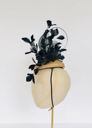 natural straw pillbox fascinator with black feather spray, pleated crin and quill