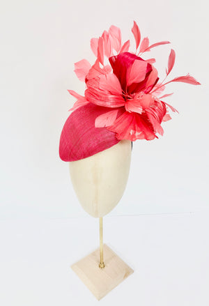 pink straw teardrop fascinator hat, with coral feather spray and silk abaca, ideal for royal ascot
