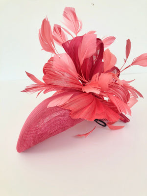 pink straw teardrop fascinator hat, with coral feather spray and silk abaca, ideal for royal ascot