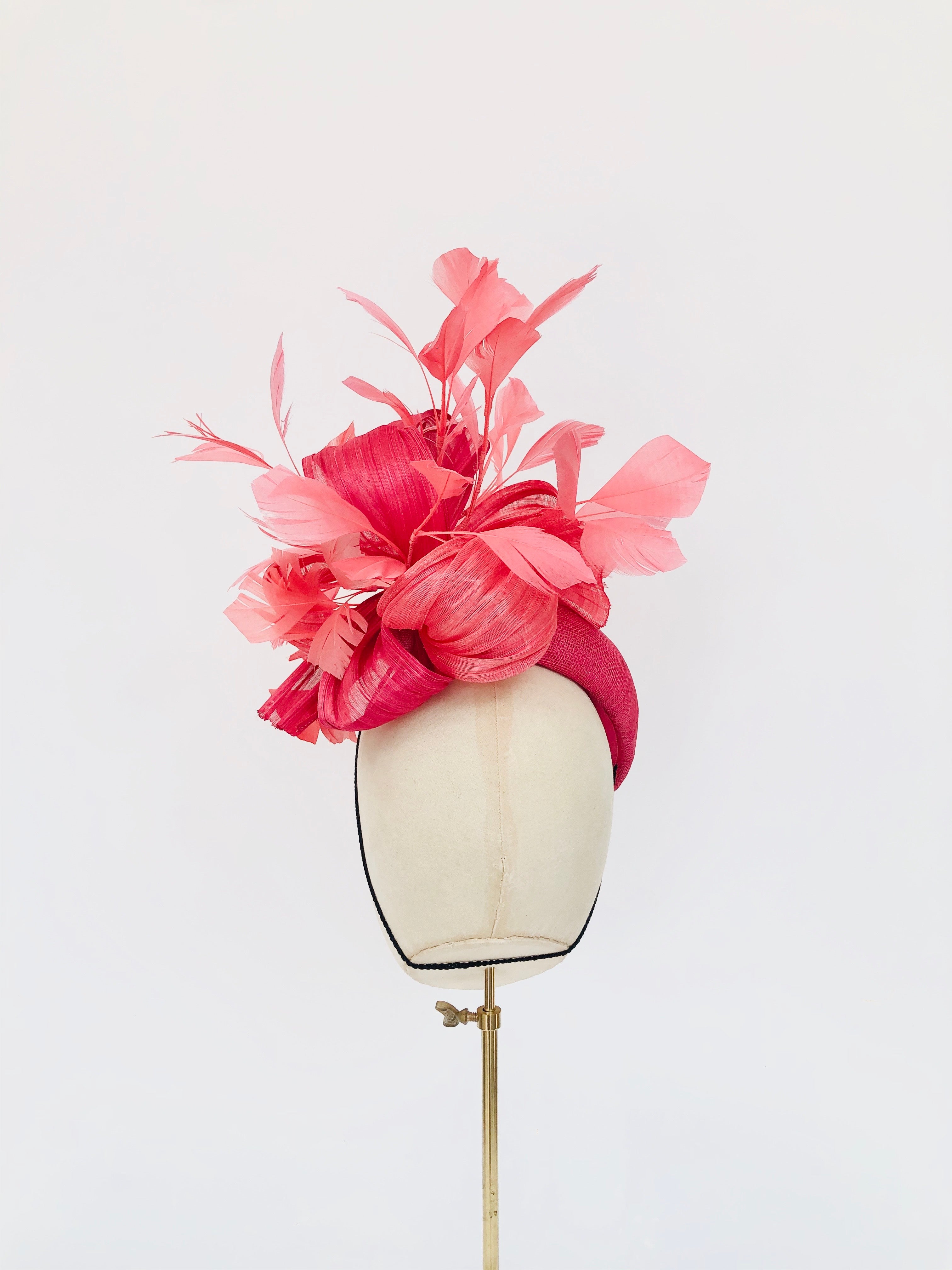 pink straw teardrop fascinator hat, with coral feather spray and silk abaca, ideal for royal ascot