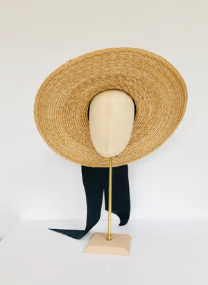 oversized wide brimmed natural straw extra large boater hat with large black moire ribbon bow with long tails