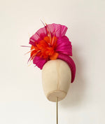 hot pink bright orange pillbox fascinator hat for weddings and royal ascot, silk abaca and feather flower finish
