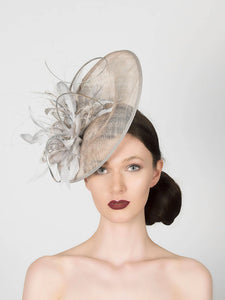 silver grey disc saucer fascinator wedding hat, with feather spray trim and metallic silver quills