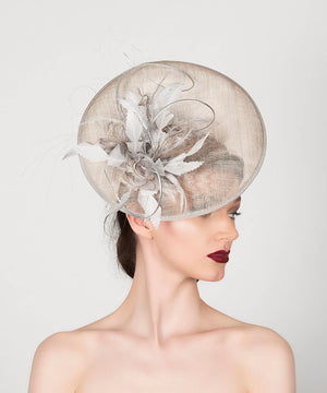 silver grey disc saucer fascinator wedding hat, with feather spray trim and metallic silver quills
