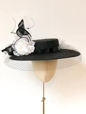 black knotted straw wide boater hat for ladies, royal ascot races, with white silk flower starw sinamy twist, black quills and black veiling