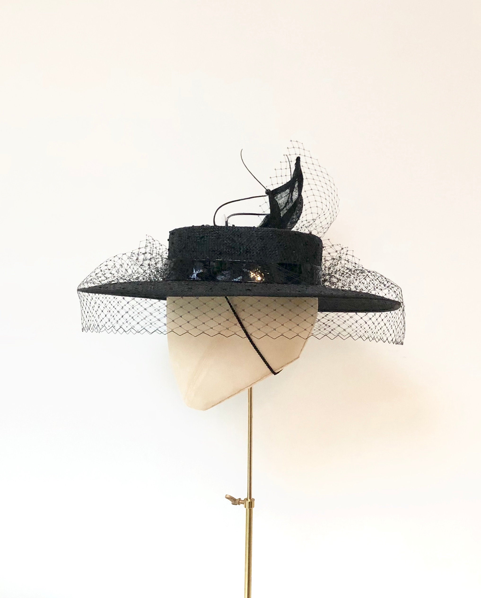 black knotted straw wide boater hat for ladies, royal ascot races, with white silk flower starw sinamy twist, black quills and black veiling