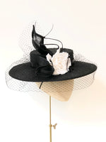black knotted straw wide boater hat for ladies, royal ascot races, with white silk flower starw sinamy twist, black quills and black veiling