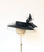 black knotted straw wide boater hat for ladies, royal ascot races, with white silk flower starw sinamy twist, black quills and black veiling
