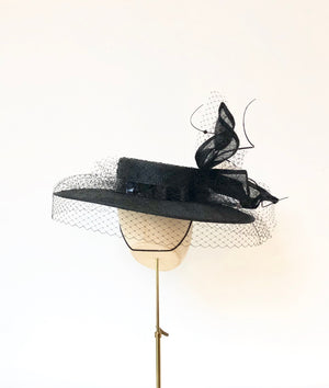 black knotted straw wide boater hat for ladies, royal ascot races, with white silk flower starw sinamy twist, black quills and black veiling