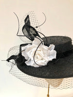 black knotted straw wide boater hat for ladies, royal ascot races, with white silk flower starw sinamy twist, black quills and black veiling