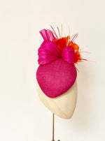 hot pink bright orange pillbox fascnator hat for weddings and royal ascot, silk abaca and feather flower finish