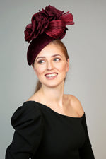 burgundy velvet teardrop fascinator hat, ideal for winter weddings, with large silk flower and silk abaca loops