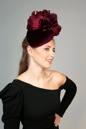 burgundy velvet teardrop fascinator hat, ideal for winter weddings, with large silk flower and silk abaca loops