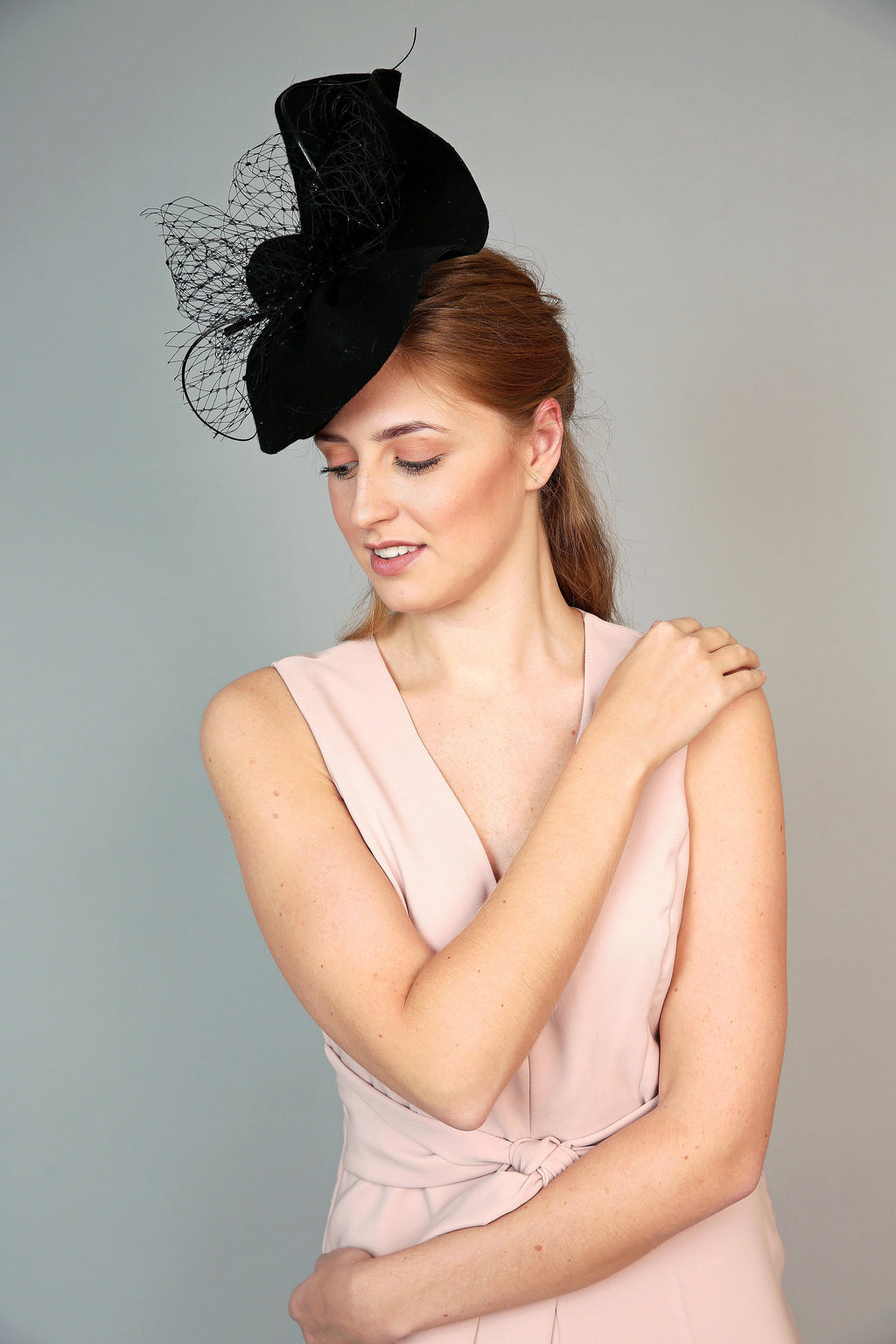 black handshaped wave fascinator felt winter wedding hat with veiling and quills