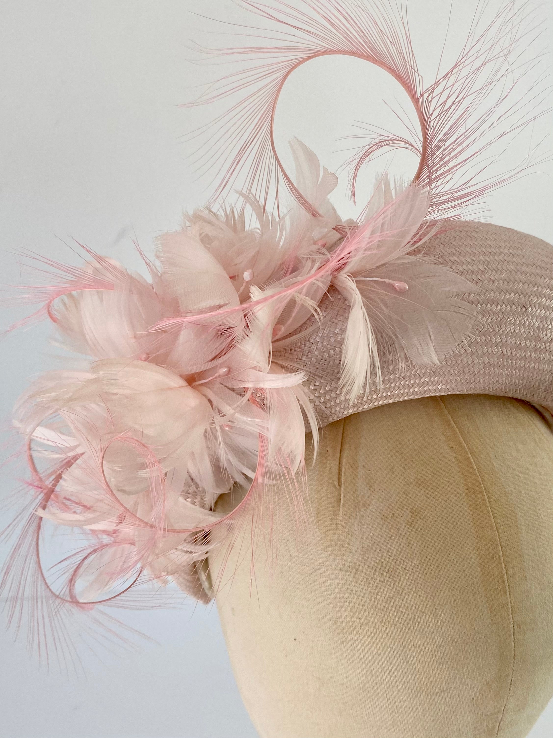 close up detail of padded headband with feather flowers Royal Ascot, Wedding headband
