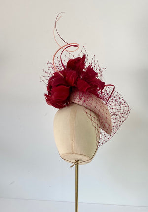 red hat with flowers and veiling for weddings Royal Ascot hat fascinator