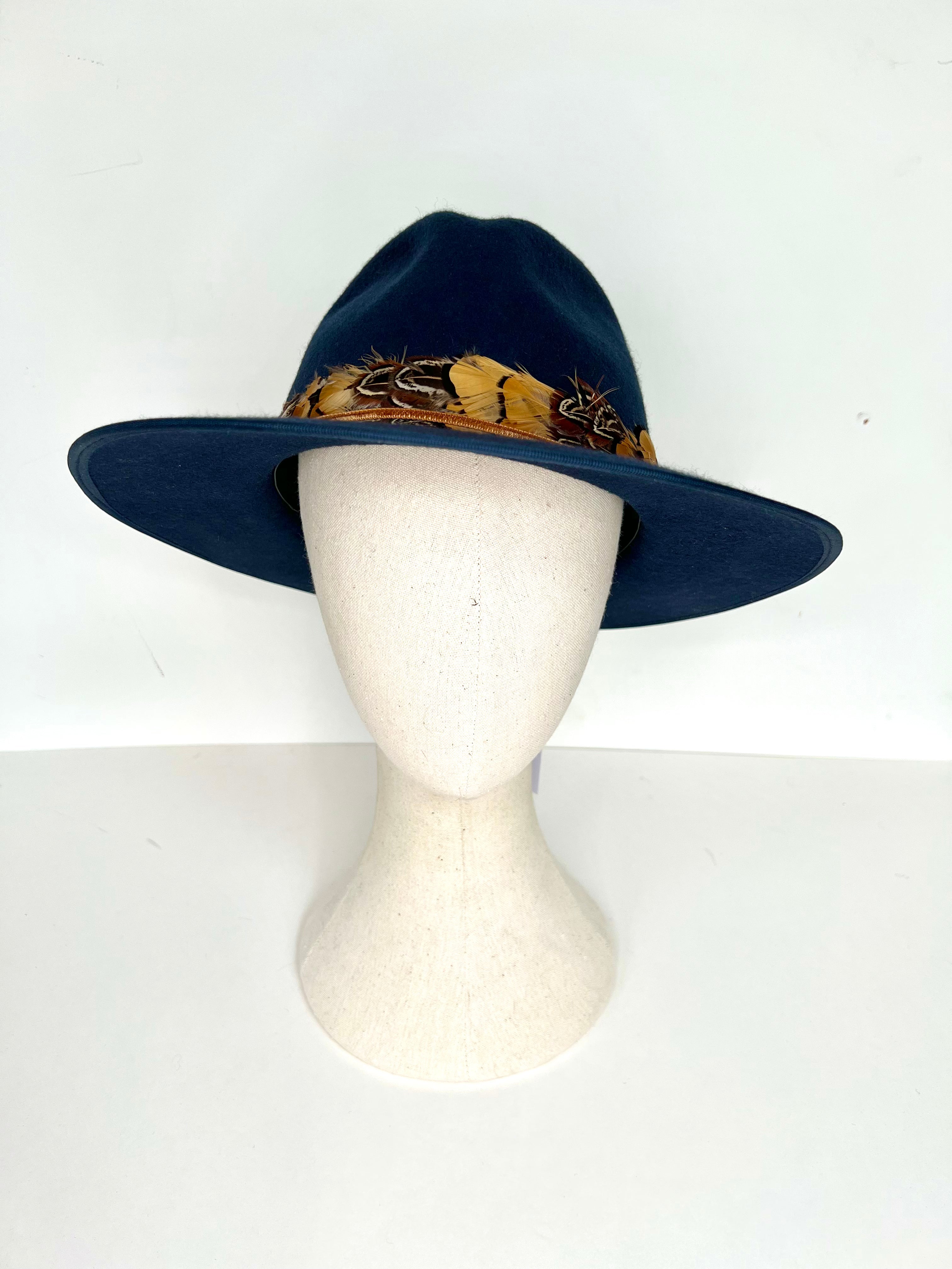 navy blue wool felt fedora with natural feather band