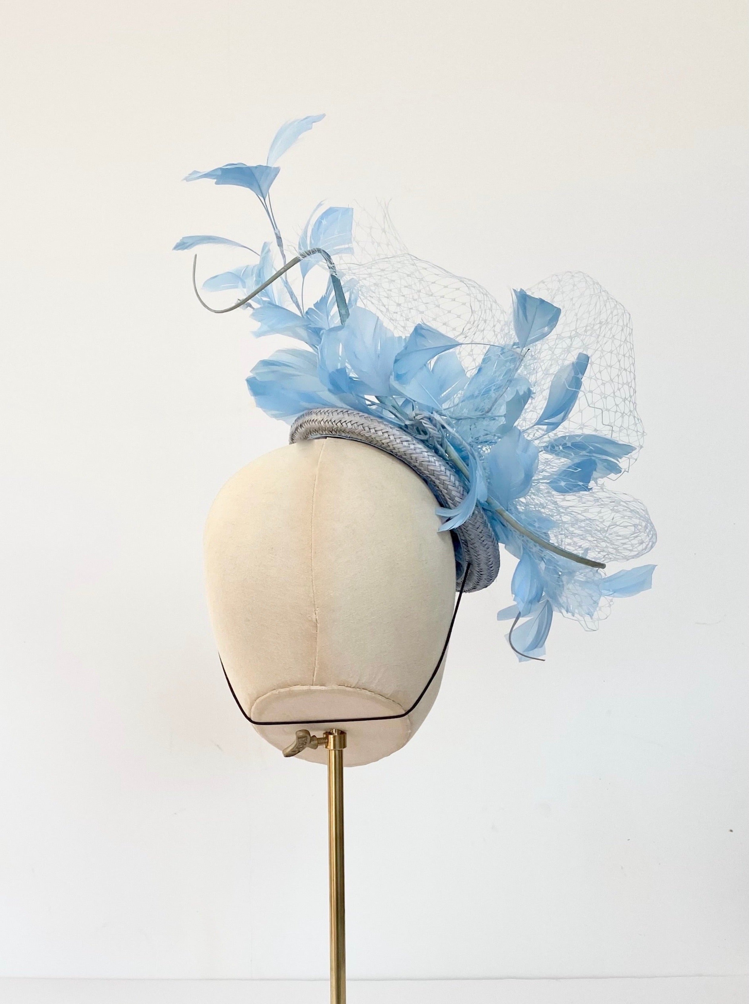 pale blue mother of the bride hat royal ascot wedding hat with feathers and veiling button cocktail hat