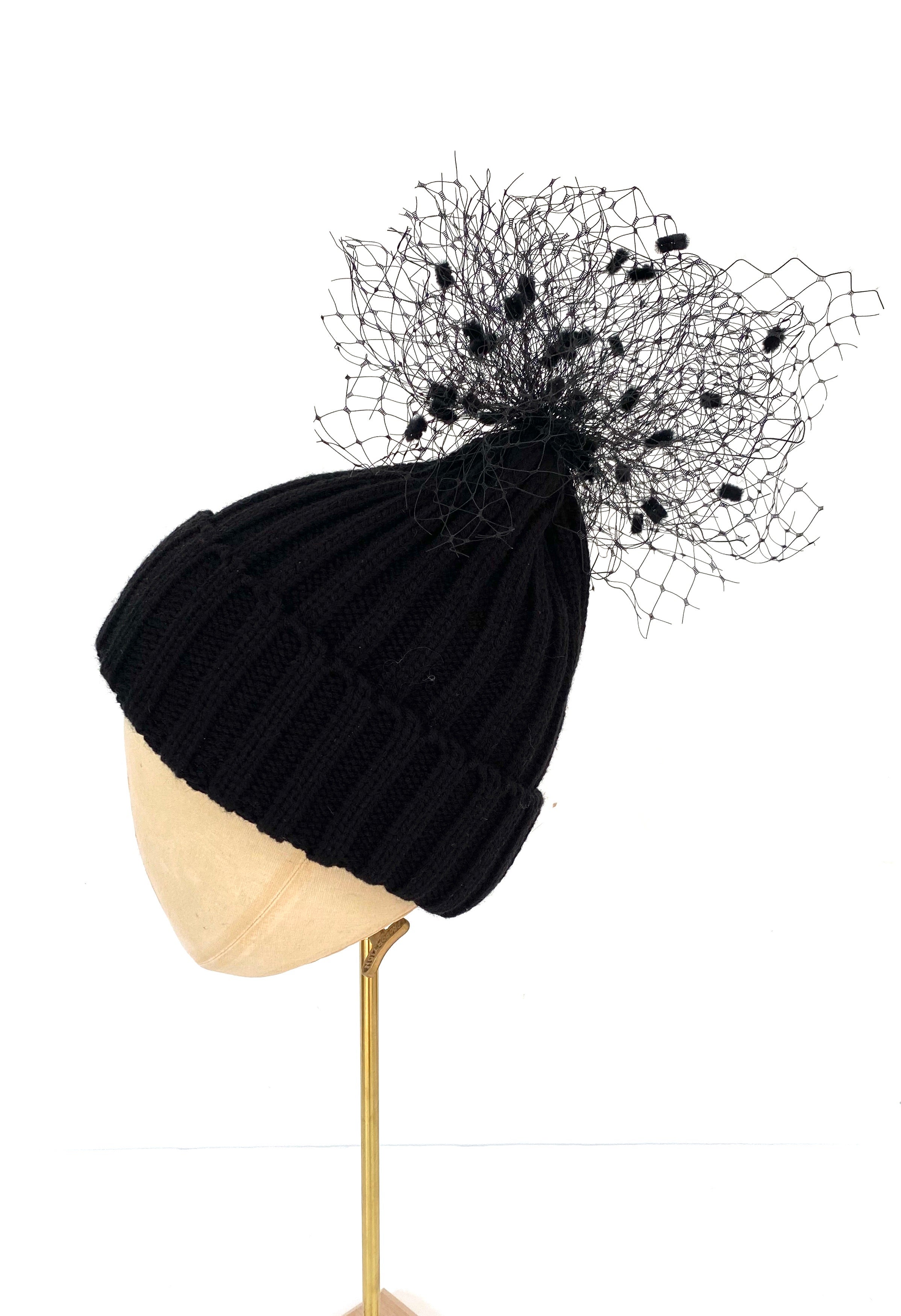 black knitted beanie bobble hat with pom pom veiling