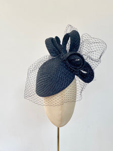 navy classic cocktail hat with bow loops and birdcage veiling - ideal for wedding guest mother of the bride hat