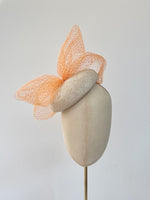 orange and yellow cocktail button hat with bow and veiling, ideal for ascot or wedding guest