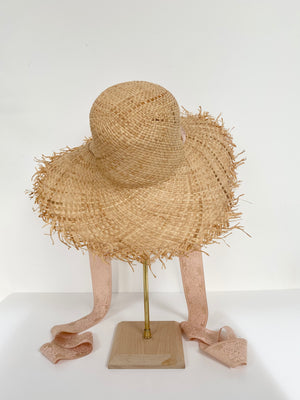natural wide brim straw hat with ballet pink ribbon ties