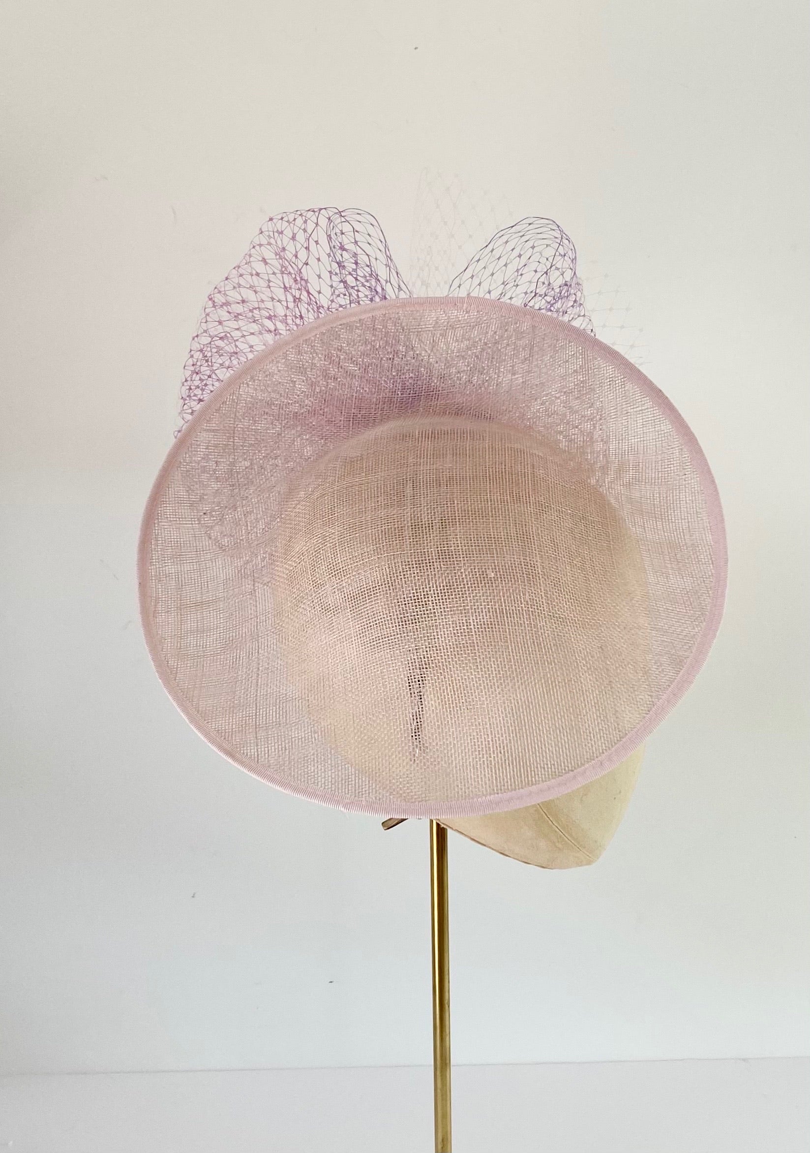 soft pink disc saucer hat with lavender lilac mauve tones veiling wedding hat Royal Ascot