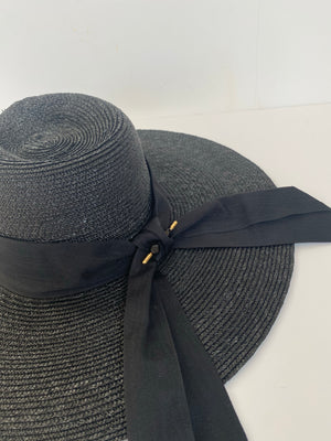 large wide brimmed sun hat black with large bow at back Moira rose inspired