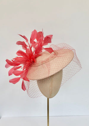 coral and peach panama disc saucer fascinator hat with coral feather spray and coral veiling