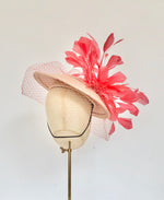 coral and peach panama disc saucer fascinator hat with coral feather spray and coral veiling