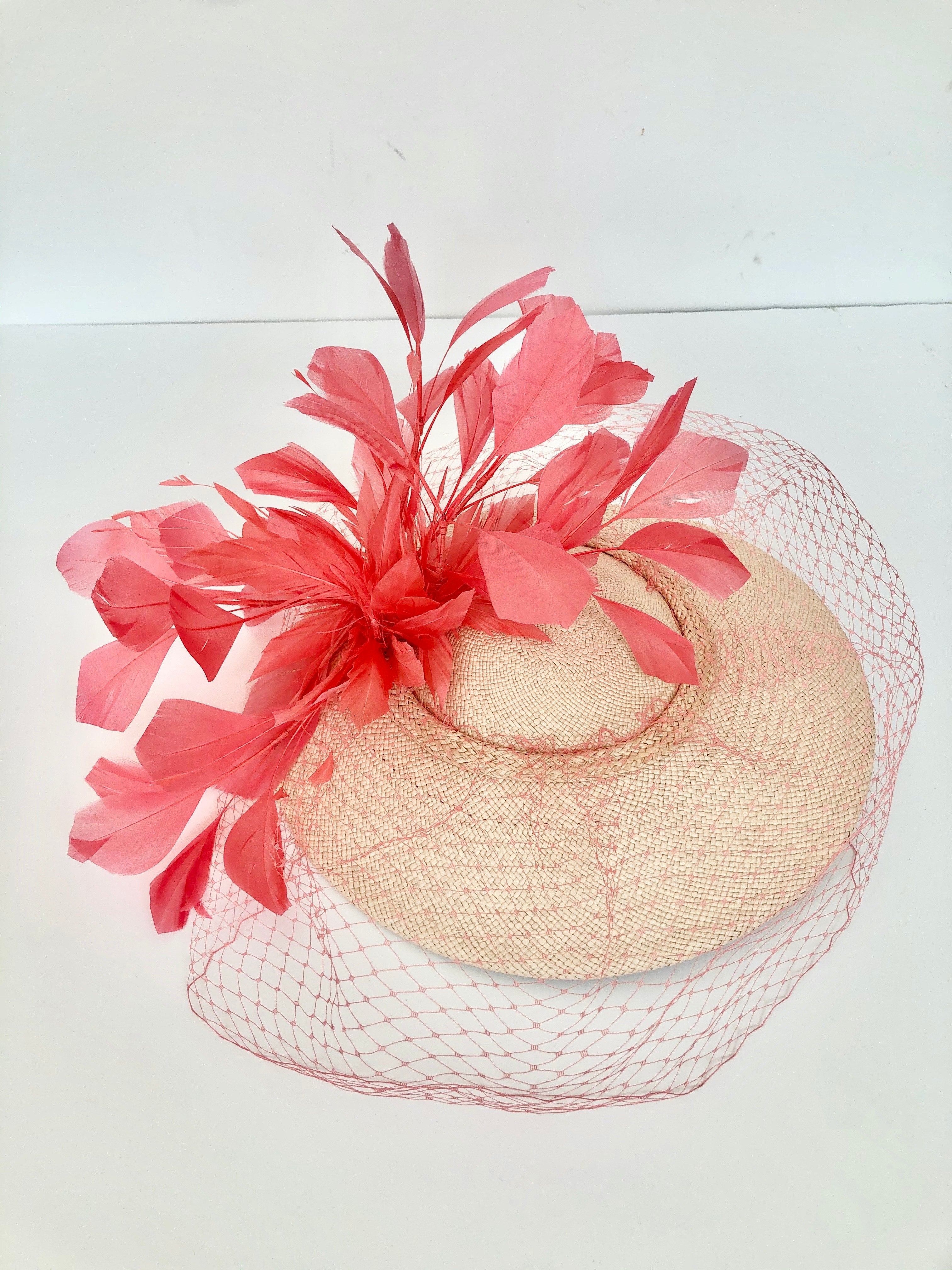 coral and peach panama disc saucer fascinator hat with coral feather spray and coral veiling