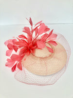 coral and peach panama disc saucer fascinator hat with coral feather spray and coral veiling